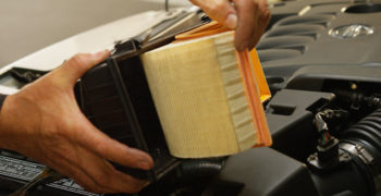 engine air filter being removed from the housing