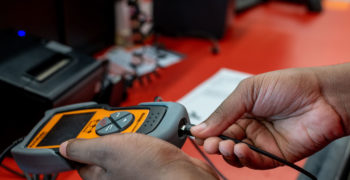 AutoZoner hooking up FixFinder to evaluate P0457 trouble code.