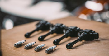 ignition coils and spark plugs on a workshop table